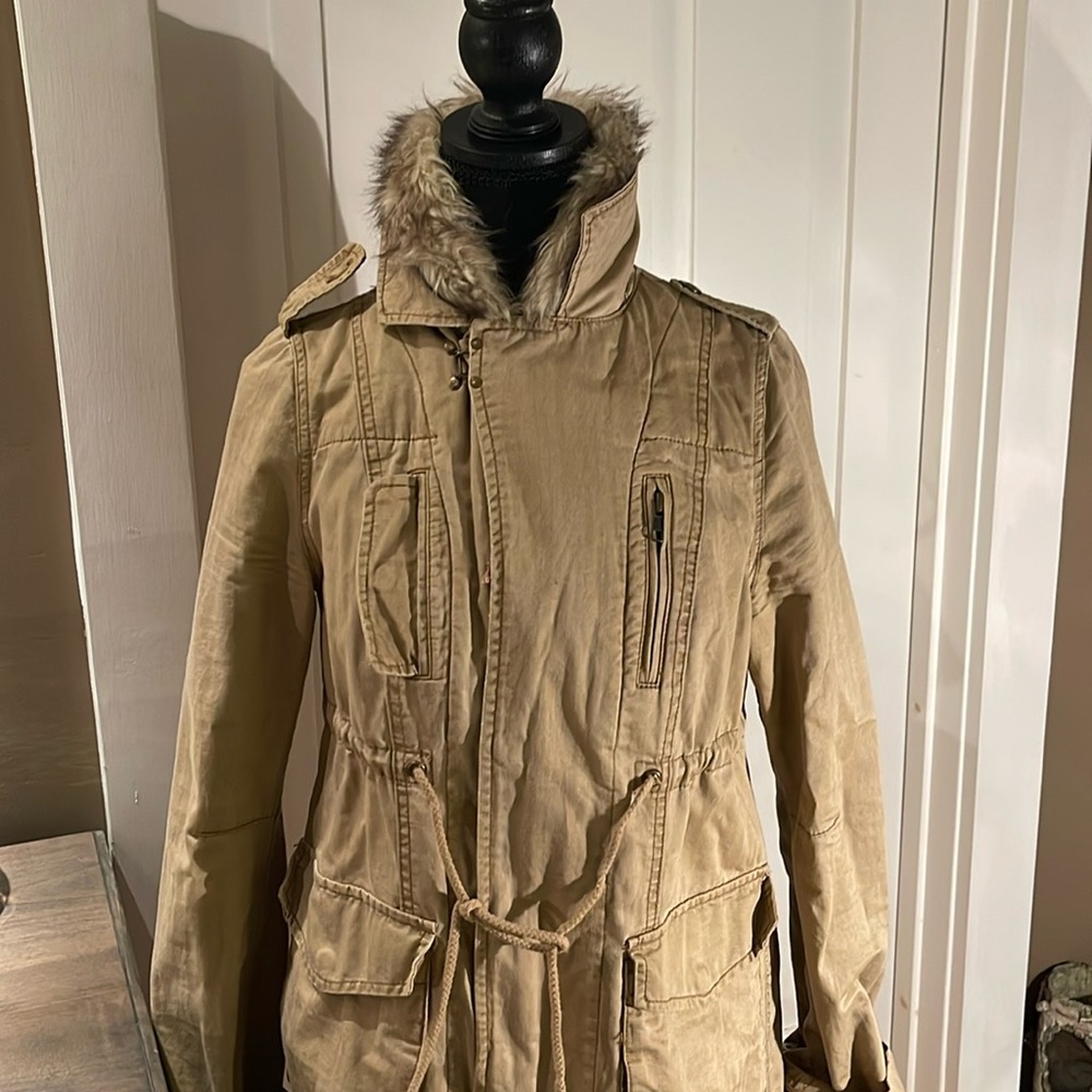 Free people jacket with liner. Fake fur and dingy mustard color.